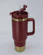 Termo tipo stanley 40 oz rojo con fondo dorado
